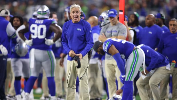 Seattle Seahawks head coach Pete Carroll (left) looks on during the first half against the Dallas Cowboys at AT&T Stadium. 